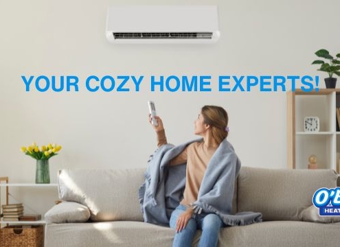 woman-with-remote-near-air-conditioner-OBoys-Heating-And-Air-ductless-heating-and-ac-services-advantages
