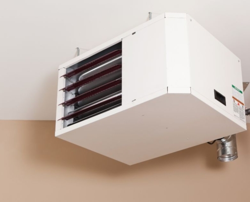 white heater in the corner of a garage - O'Boys Heating & Air garage heater