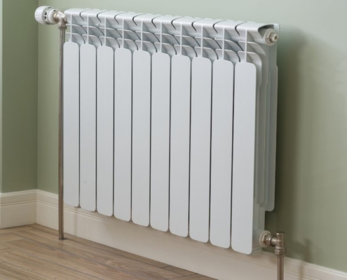 white radiator on beige wall - O'Boys Heating & Air radiator