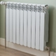 white radiator on beige wall - O'Boys Heating & Air radiator